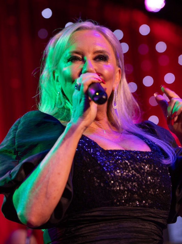 Close-up of Michelle Morrison singing