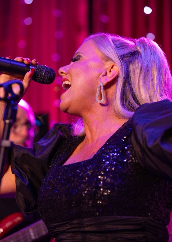 Michelle Morrison singing, side profile